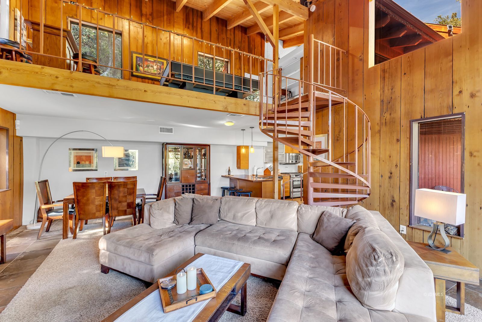 53580 Jeffery Pine Road Idyllwild, CA 92549 - Photo 20 of 90 a view of a patio with couches and a dining table under an umbrella