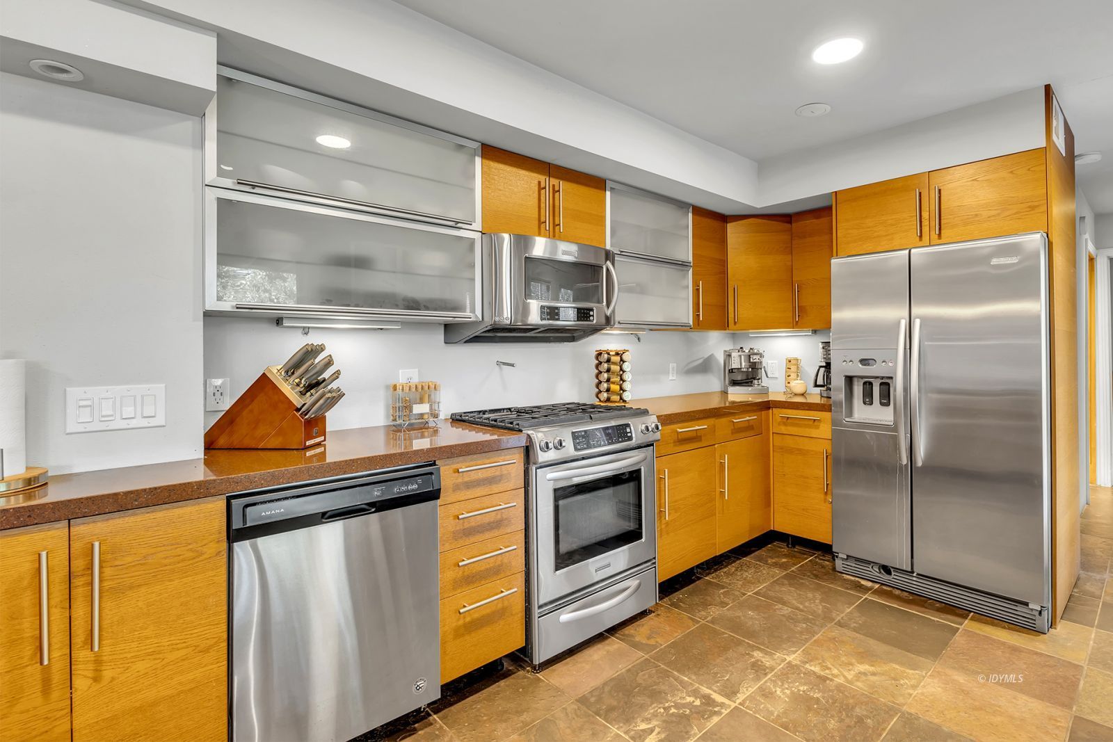 53580 Jeffery Pine Road Idyllwild, CA 92549 - Photo 27 of 90 a kitchen with stainless steel appliances granite countertop a stove a refrigerator and a sink