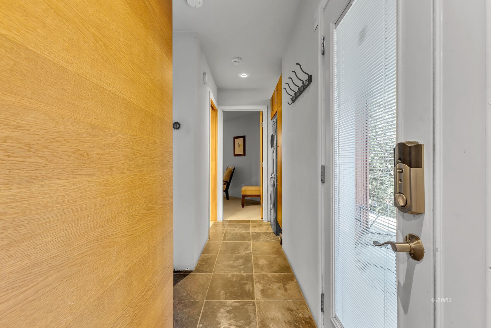 53580 Jeffery Pine Road Idyllwild, CA 92549 - Photo 32 of 90 a view of a hallway with wooden floor and a bathroom