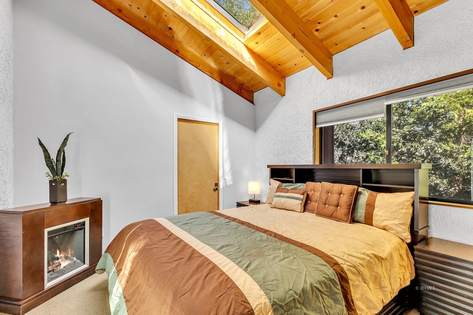 53580 Jeffery Pine Road Idyllwild, CA 92549 - Photo 57 of 90 a bedroom with a bed and wooden floor