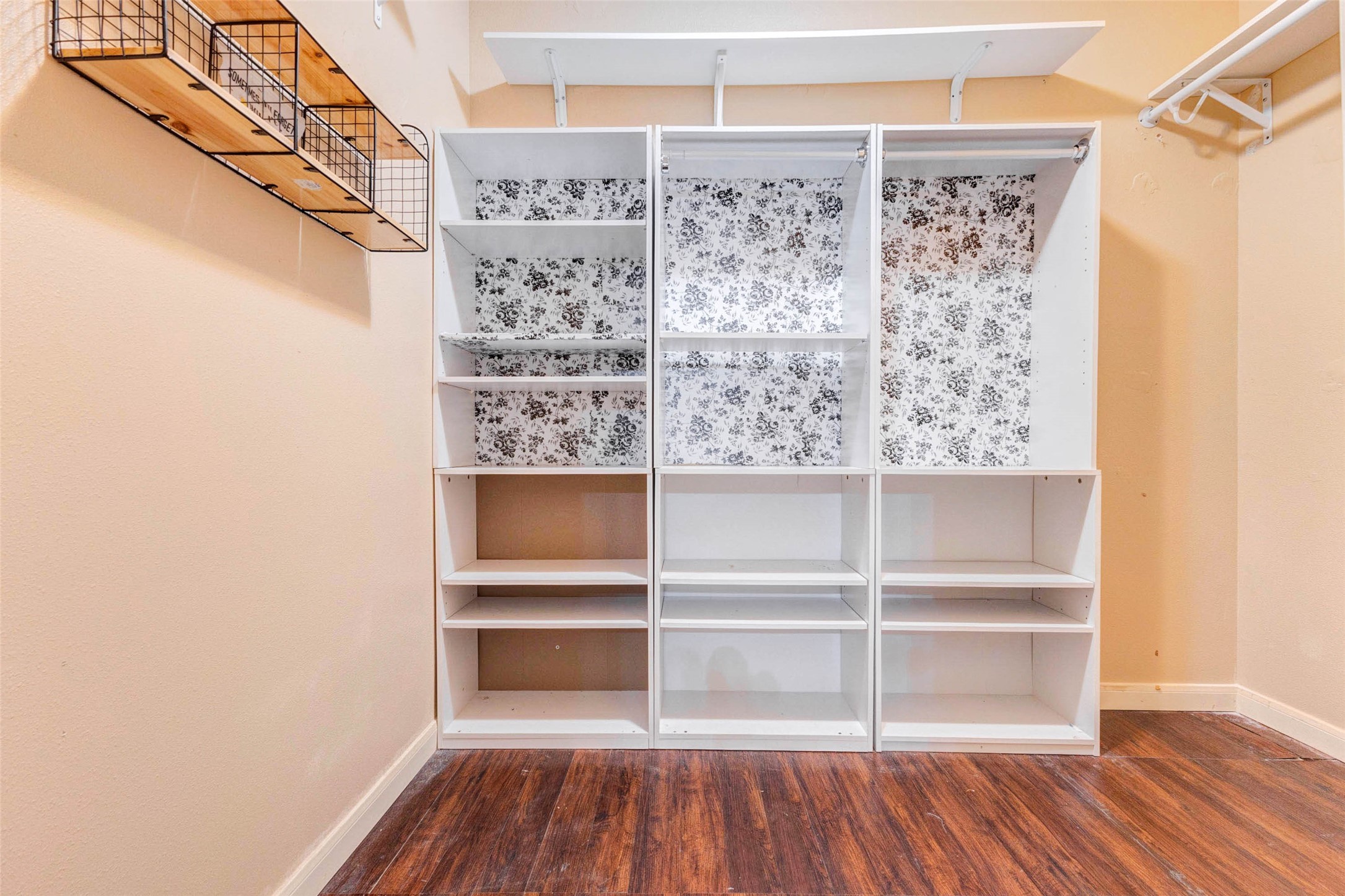 14522 Durham Chase Lane Houston, TX 77095 - Photo 30 of 40 a view of walk in closet with empty racks