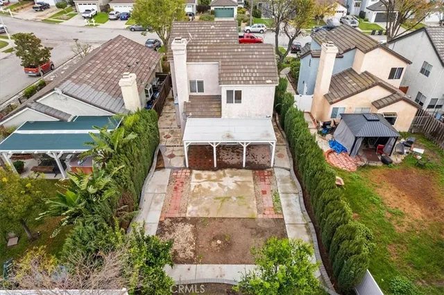 an aerial view of residential houses with outdoor space