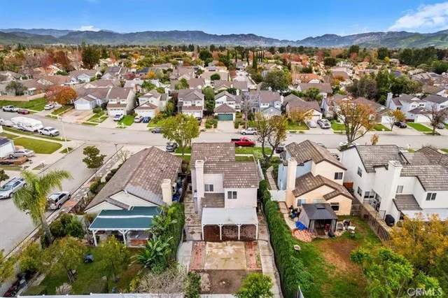 a aerial view of a house with a yard