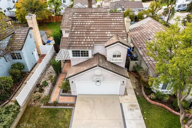 a picture of a room with a white wall and white refrigerator