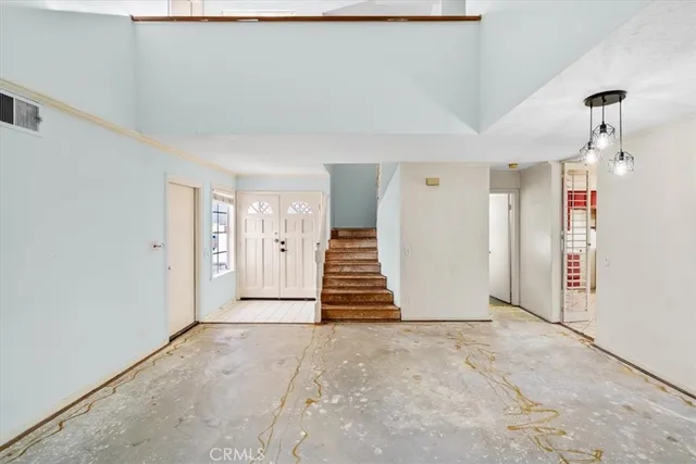 a view of a livingroom with stairs
