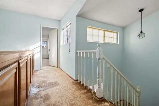 a view of a hallway with windows