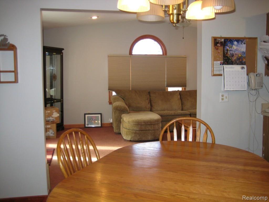 2257 Fowlerville Road Fowlerville, MI 48836 - Photo 4 of 9 VIEW OF FAMILY ROOM FROM DINING AREA