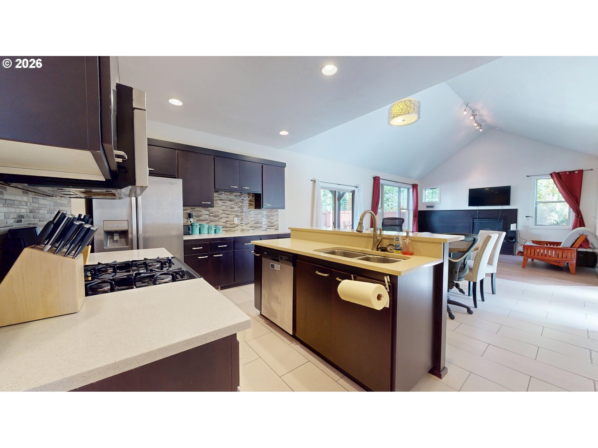 375 Mia Lane Eugene, OR 97401 - Photo 15 of 44 a kitchen with a stove a refrigerator and a dining table