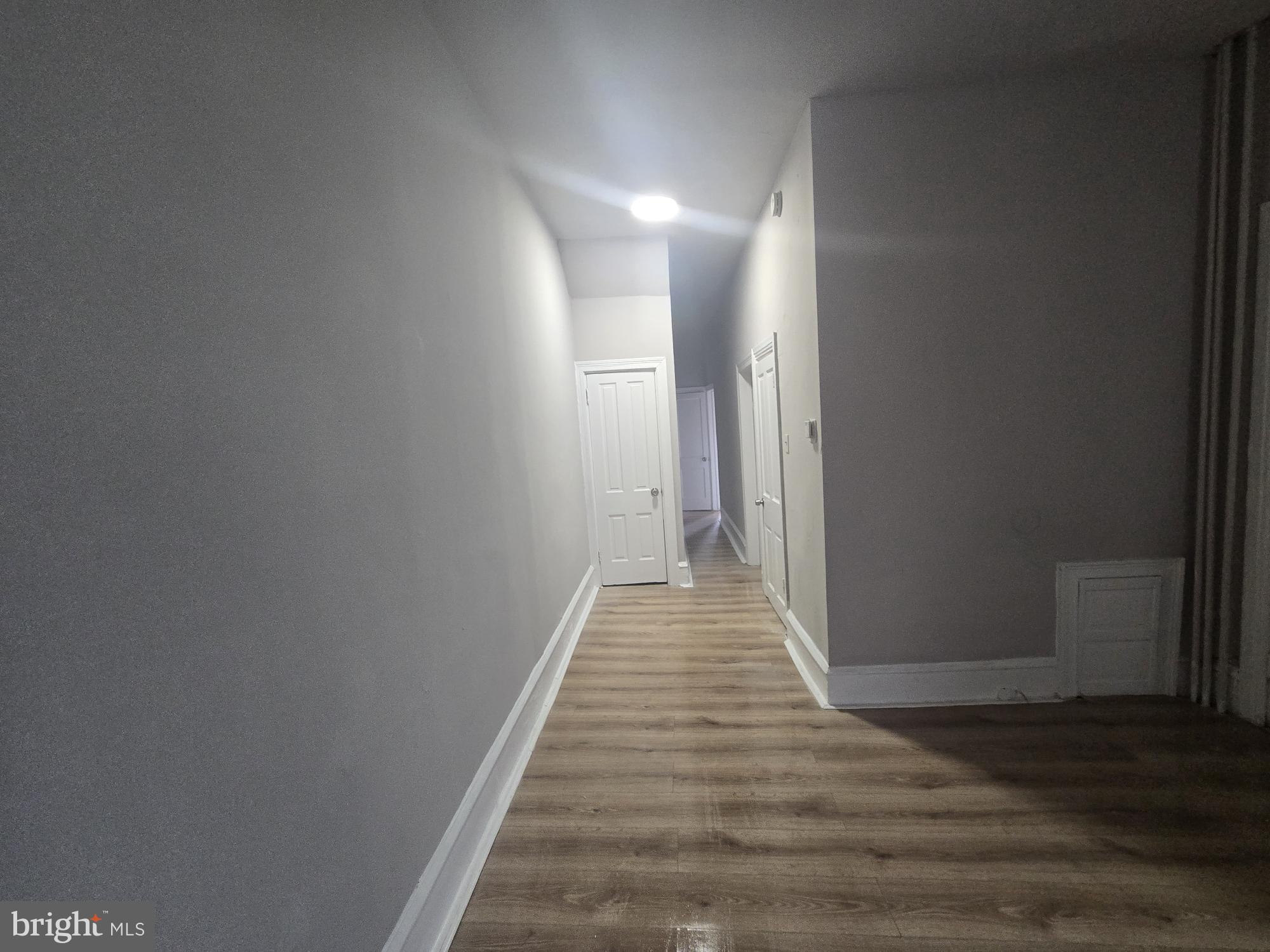6700-6702 Keystone Street Philadelphia, PA 19135 - Photo 5 of 10 a view of a hallway with wooden floor