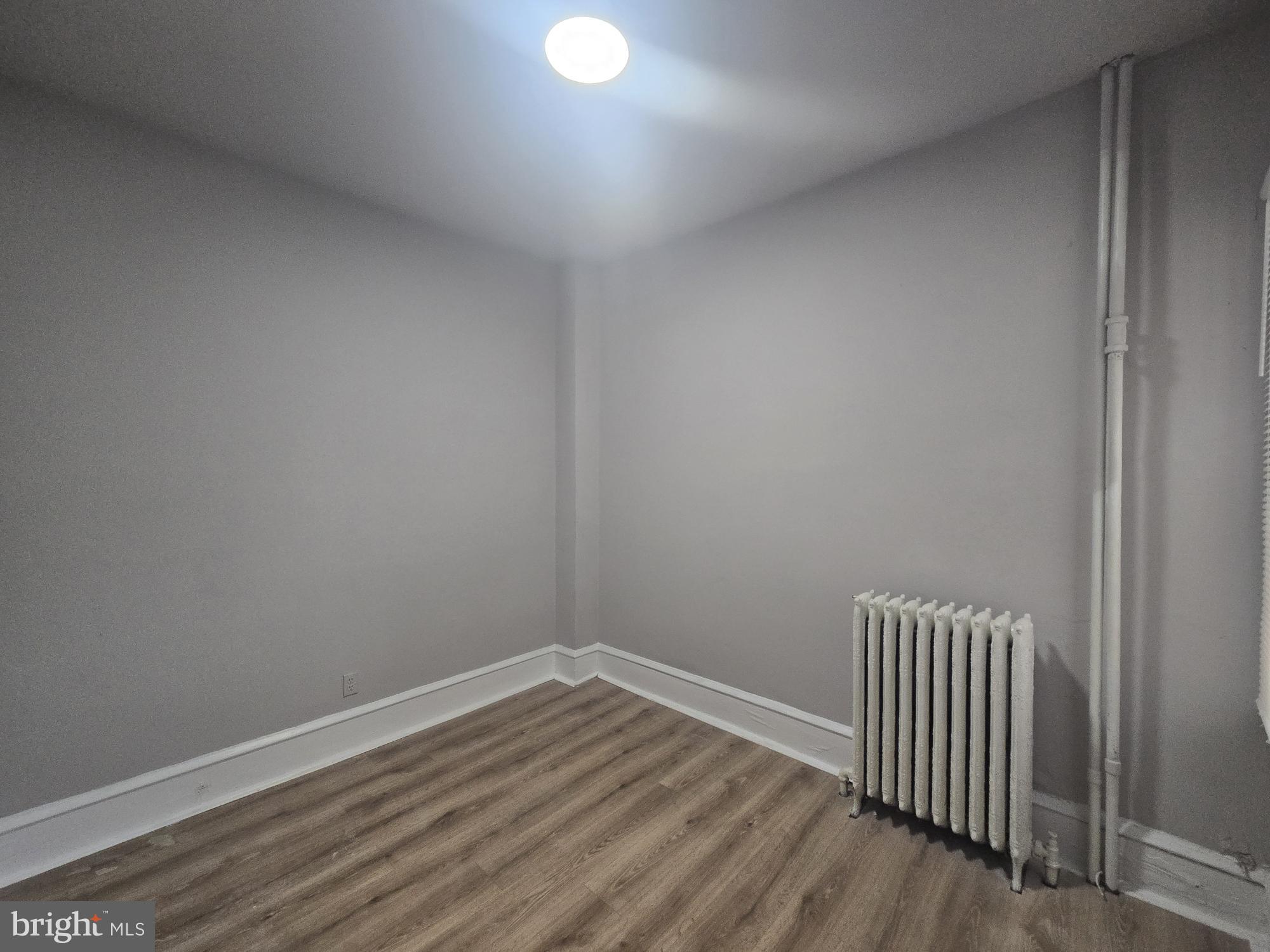 6700-6702 Keystone Street Philadelphia, PA 19135 - Photo 6 of 10 a view of a room with wooden floor