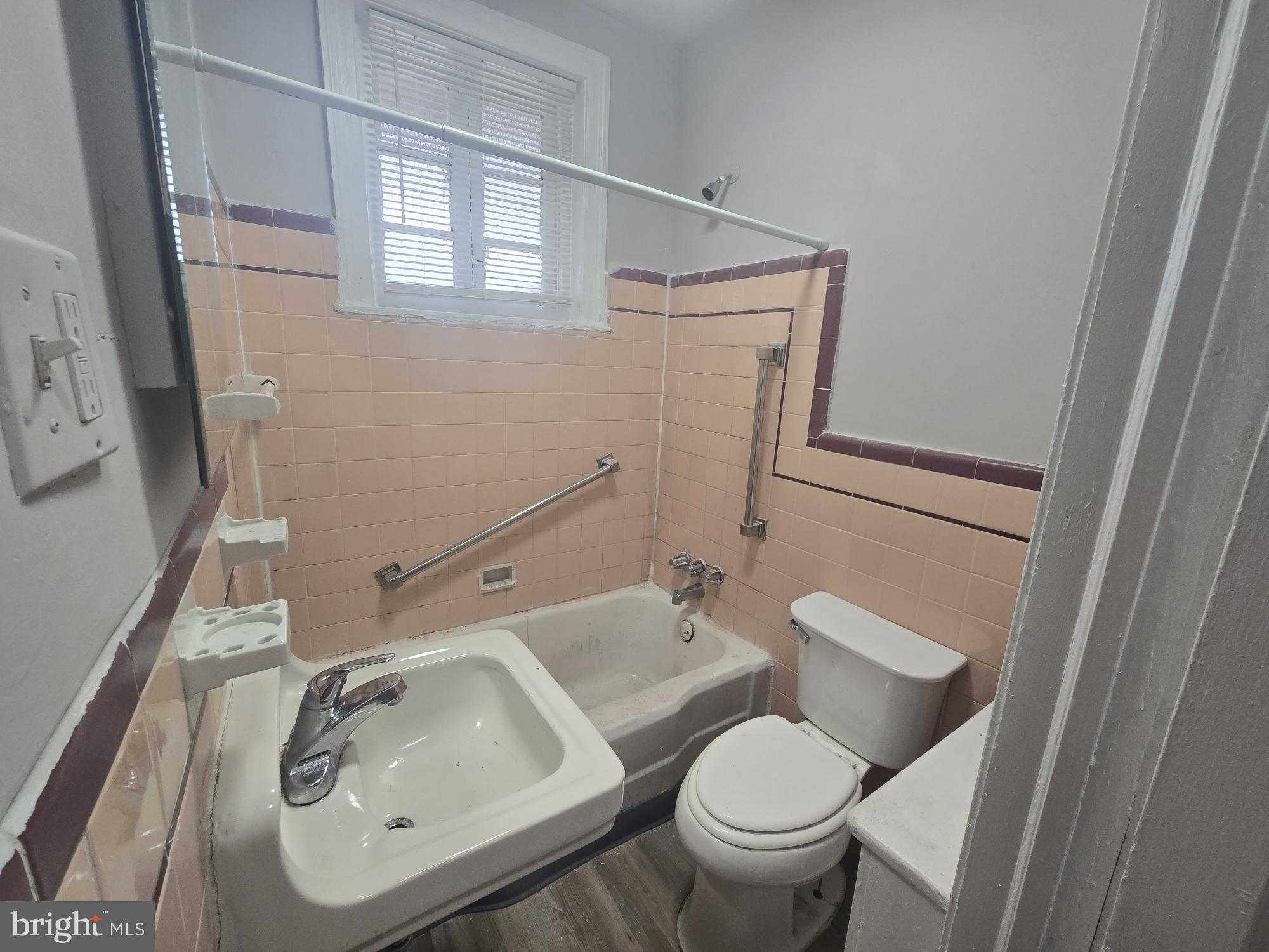6700-6702 Keystone Street Philadelphia, PA 19135 - Photo 8 of 10 a bathroom with a sink toilet and mirror