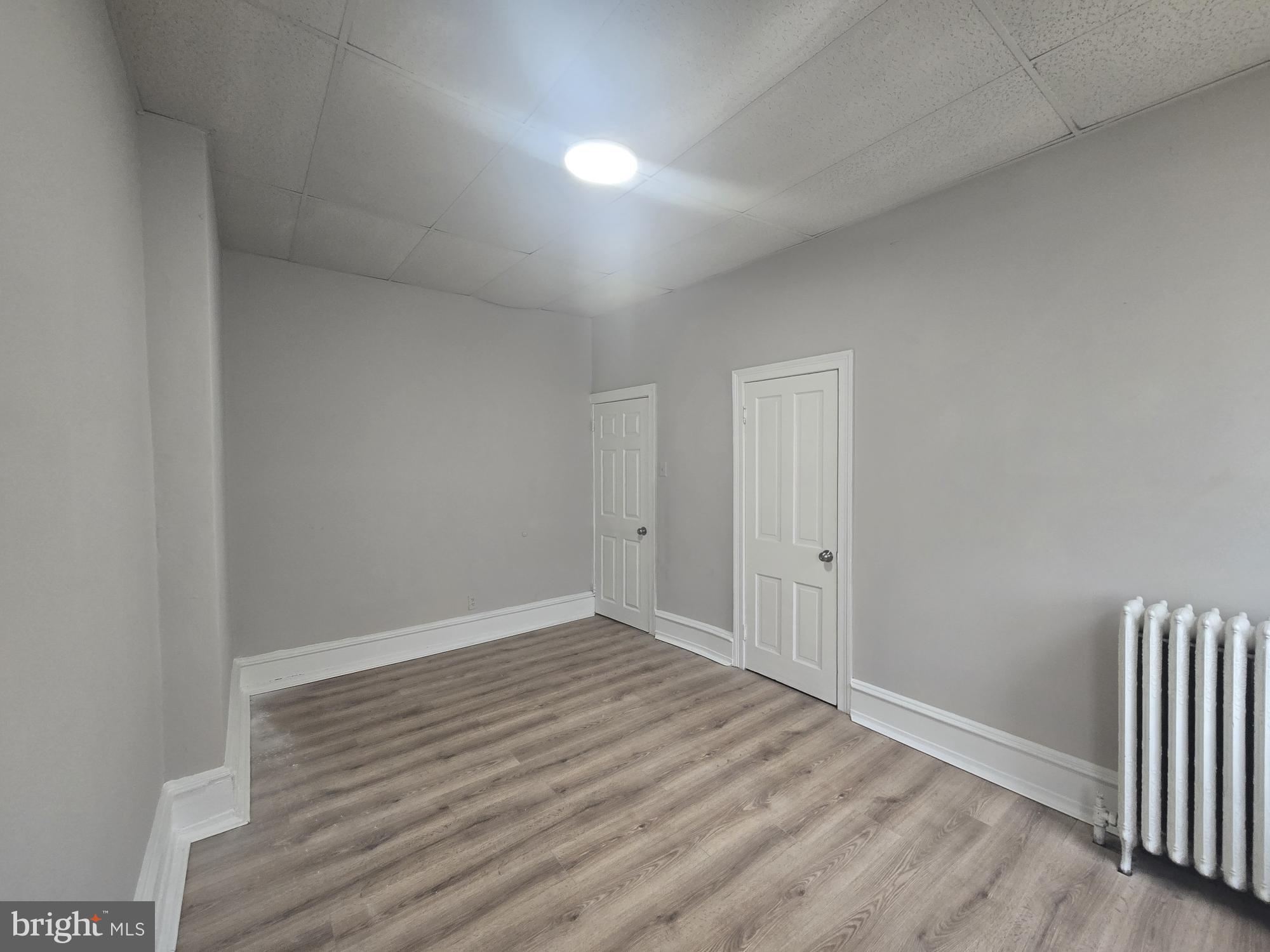6700-6702 Keystone Street Philadelphia, PA 19135 - Photo 10 of 10 a view of a room with wooden floor and fence