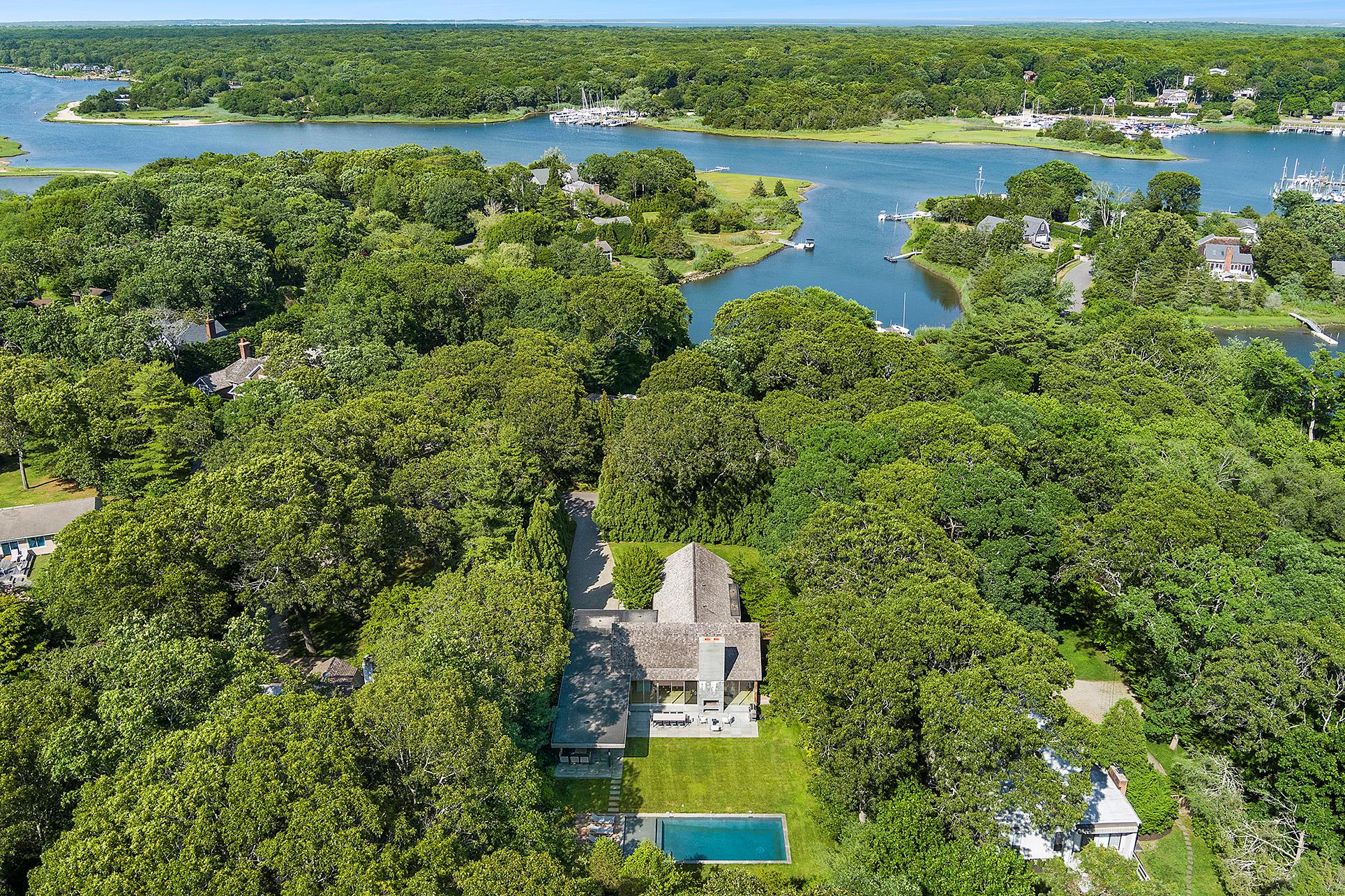 25 Oyster Shores Road East Hampton, NY 11937 - Photo 1 of 1 Bird's eye view featuring a water view and a forest view