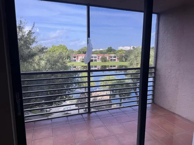 a view of a lake from a balcony