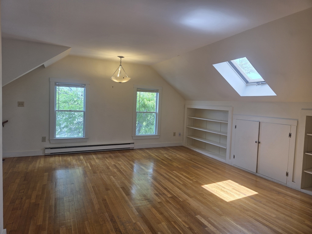 14 Hawkes Street, Unit 2 Marblehead, MA 01945 - Photo 1 of 12 an empty room with wooden floor closet and windows