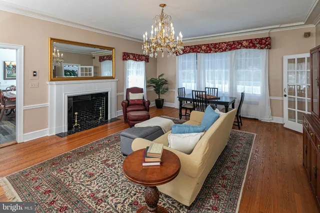 a kitchen with a table chairs stove and cabinets