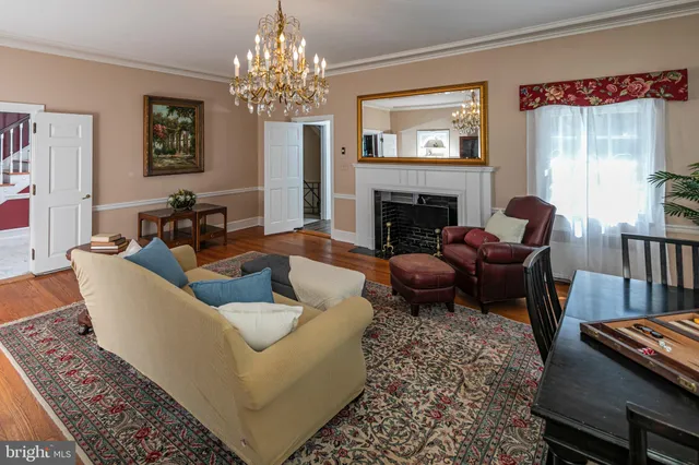 a kitchen with kitchen island a counter space a sink appliances and cabinets