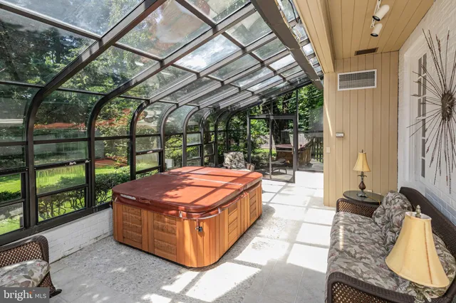 a living room with a bed and a fireplace
