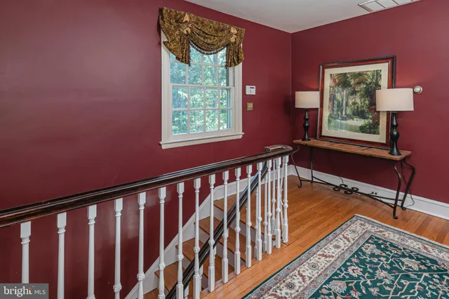 a bedroom with a bed and glass door