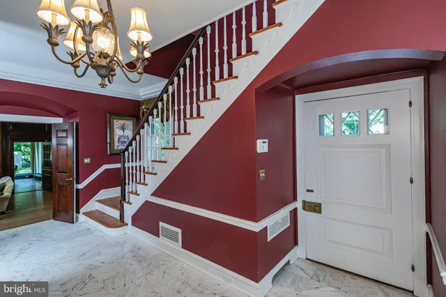 a living room with furniture fireplace and wooden floor