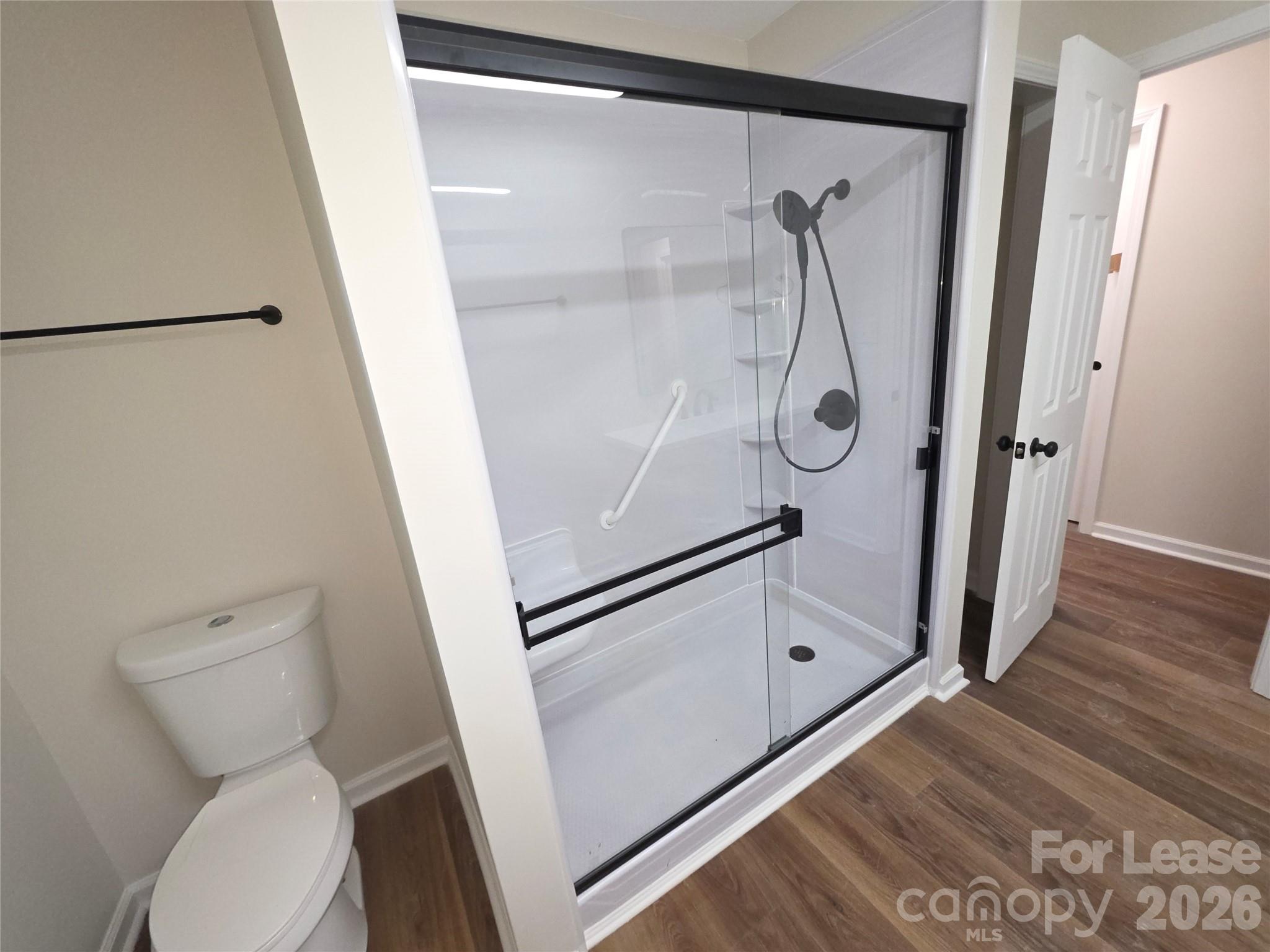 5710 Unionville Road Monroe, NC 28110 - Photo 11 of 18 a bathroom with a glass shower door