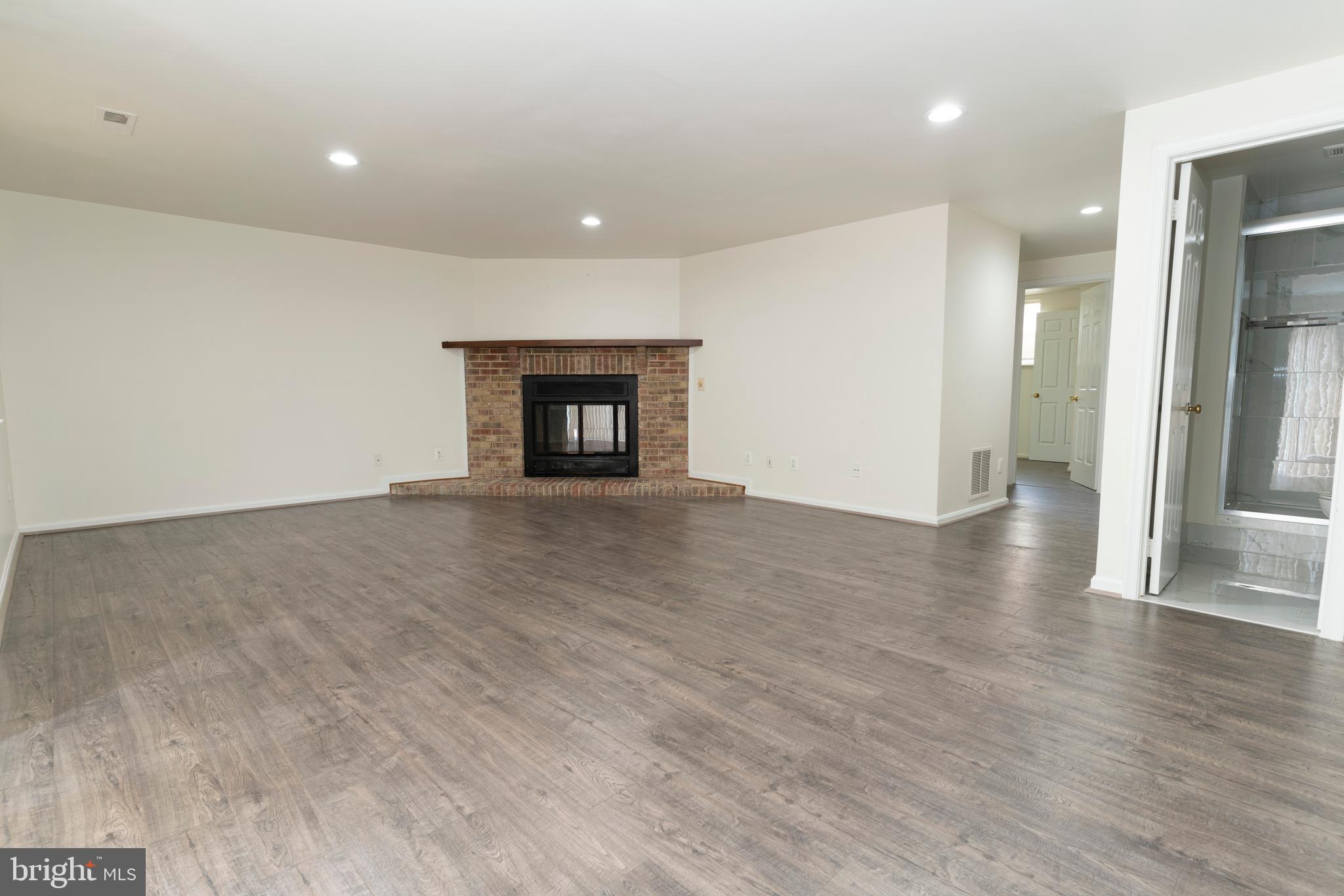 7025 Braddock Mews Place Springfield, VA 22151 - Photo 26 of 35 Spacious Recreation Room with Fireplace