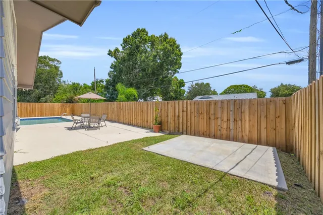 a view of backyard with small cabin