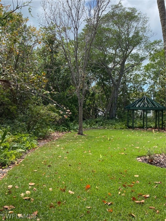 939 Beach Road Sanibel, FL 33957 - Photo 3 of 32 a view of outdoor space with deck and yard