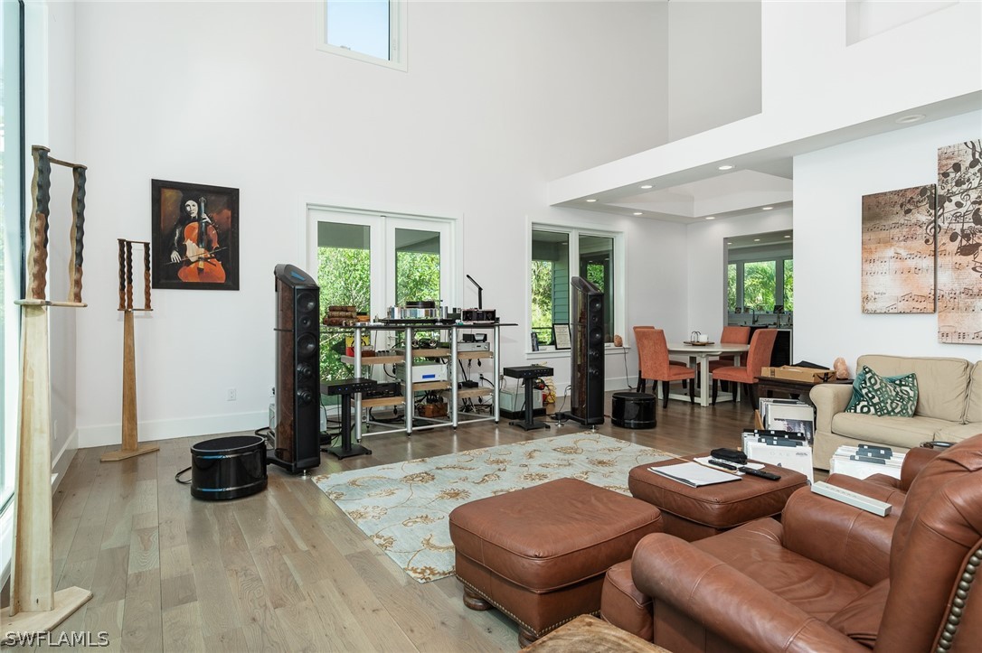 939 Beach Road Sanibel, FL 33957 - Photo 6 of 32 a living room with furniture and wooden floor