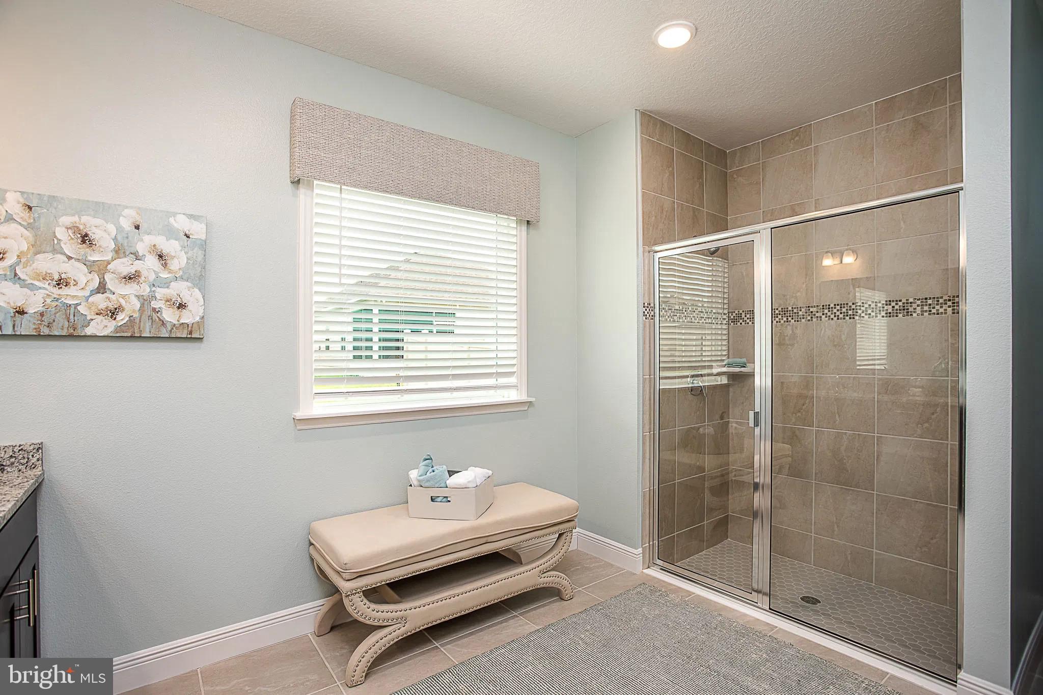 24 Williamson Road Winchester, VA 22602 - Photo 7 of 12 a bathroom with a bathtub and a shower