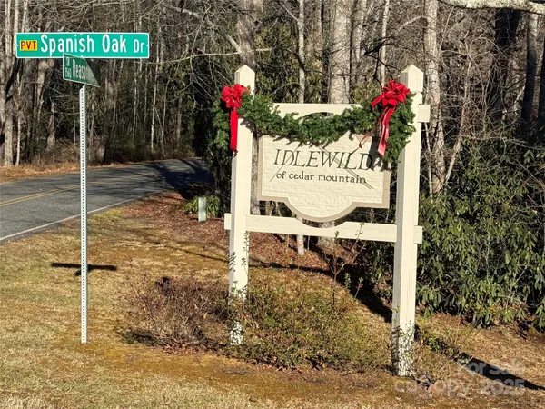 a sign board on the side of the road