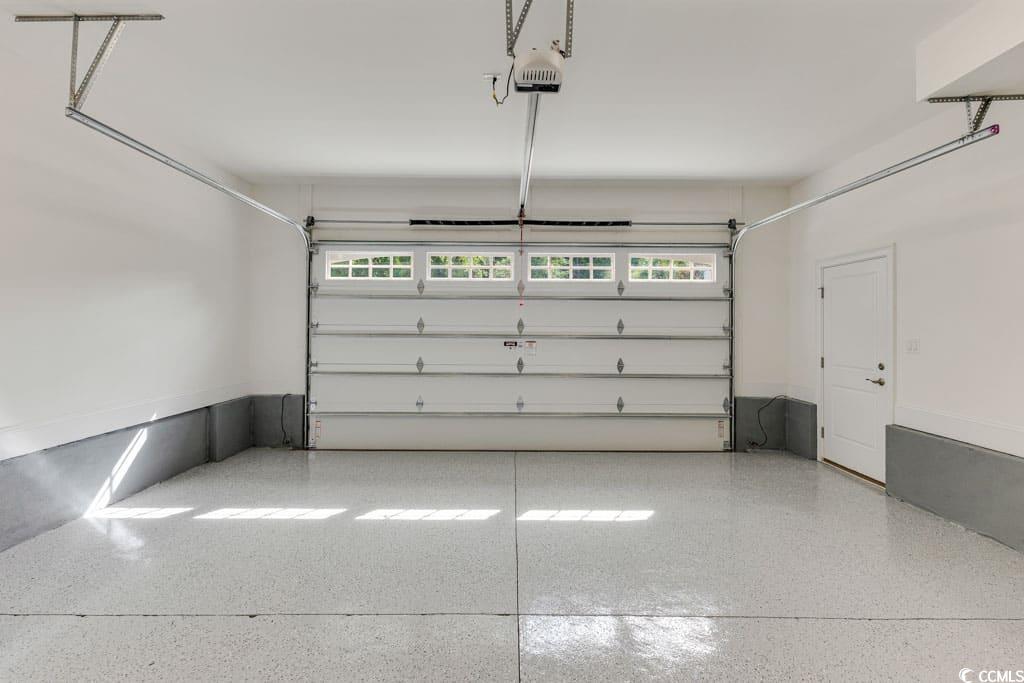394 Sea Trail Drive West Sunset Beach, NC 28468 - Photo 28 of 40 Garage with a garage door opener