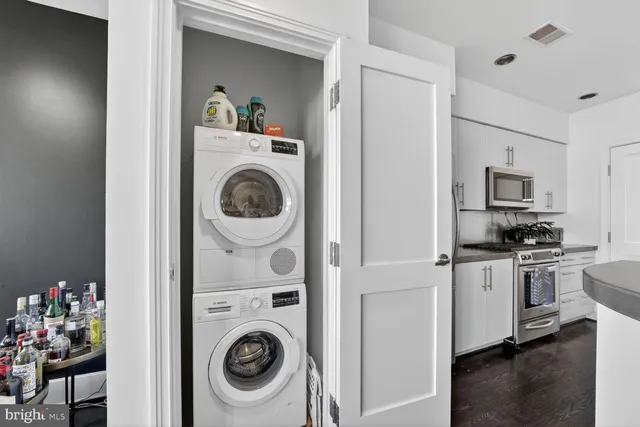 a view of kitchen sink and wooden floor