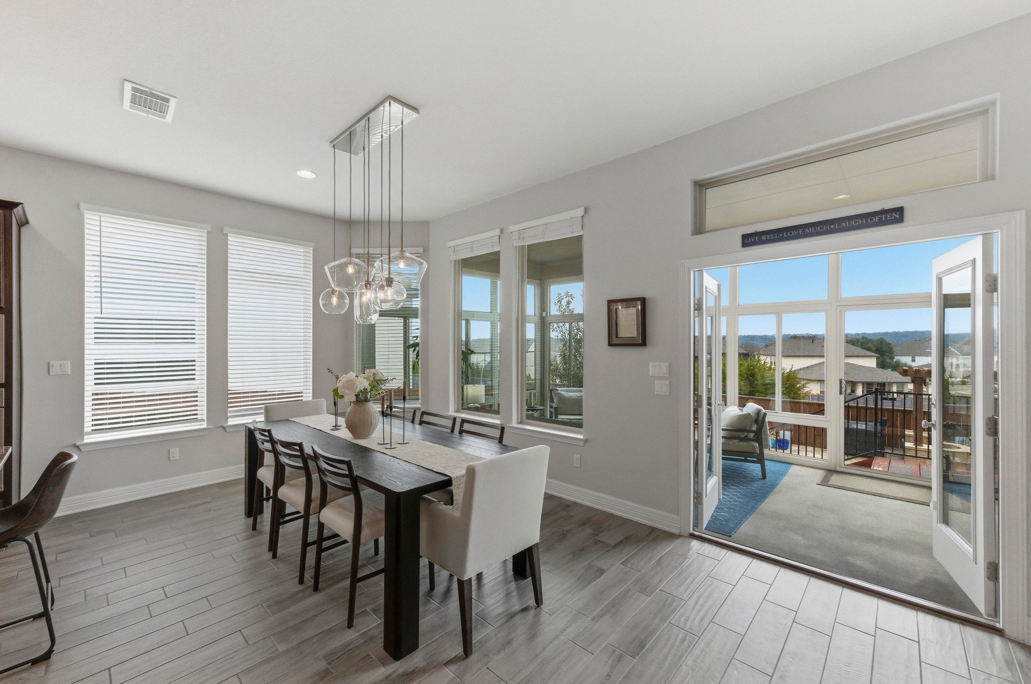 348 Panzano Drive Georgetown, TX 78628 - Photo 12 of 35 a view of a dining room with furniture window and wooden floor