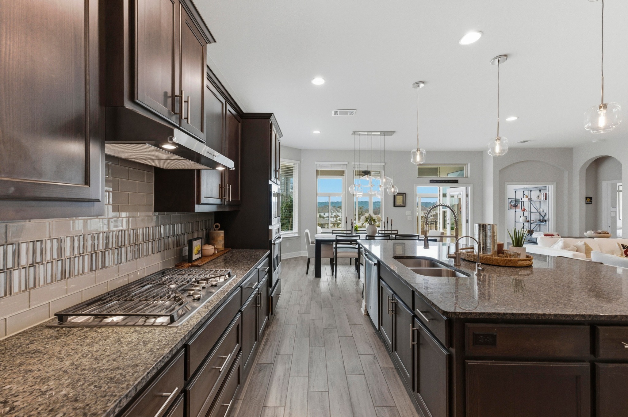 348 Panzano Drive Georgetown, TX 78628 - Photo 13 of 35 a kitchen with sink stove and cabinets