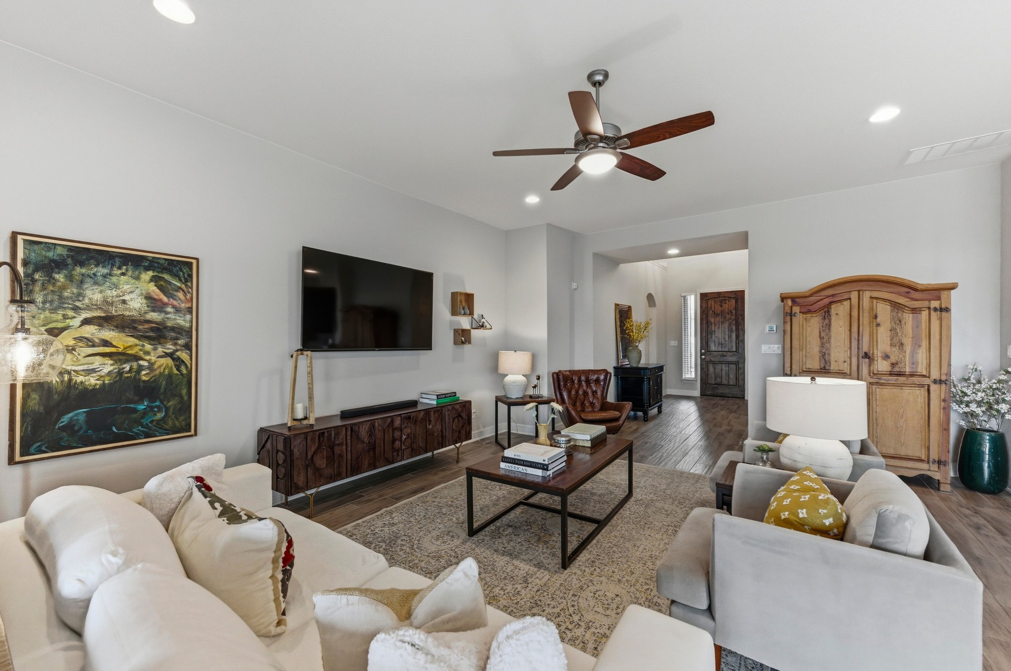 348 Panzano Drive Georgetown, TX 78628 - Photo 15 of 35 a living room with furniture and a flat screen tv