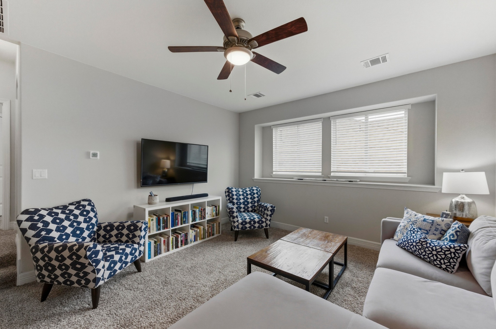 348 Panzano Drive Georgetown, TX 78628 - Photo 24 of 35 a living room with furniture and a flat screen tv
