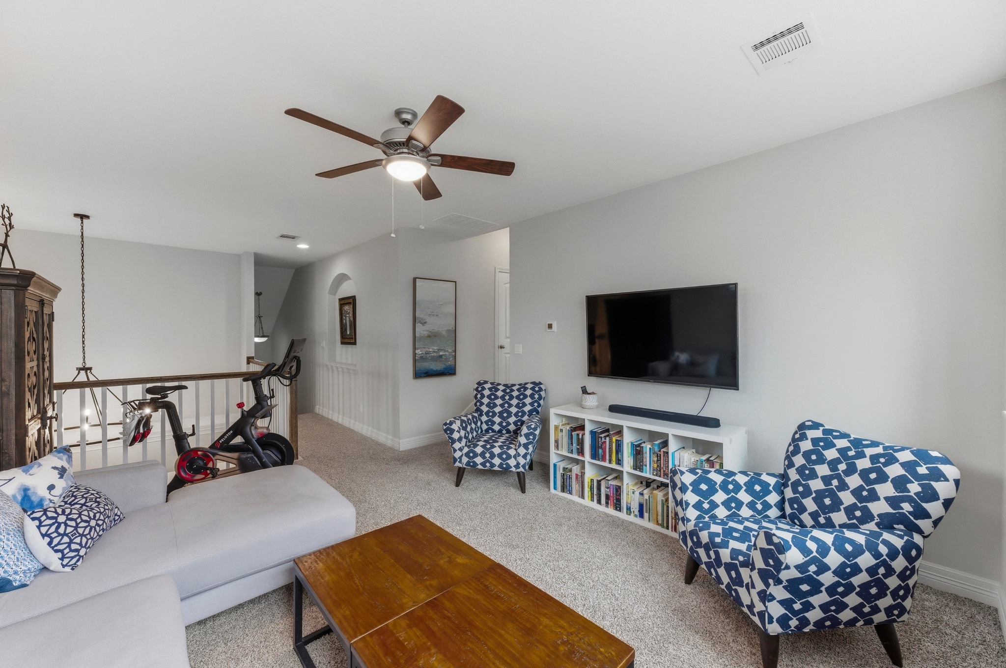 348 Panzano Drive Georgetown, TX 78628 - Photo 25 of 35 a living room with furniture and a flat screen tv