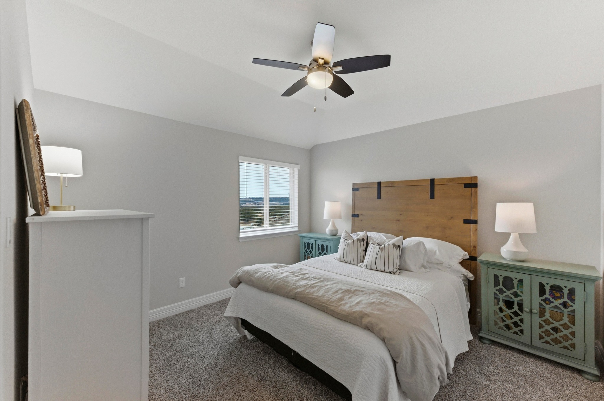 348 Panzano Drive Georgetown, TX 78628 - Photo 26 of 35 a bedroom with a large bed and a window