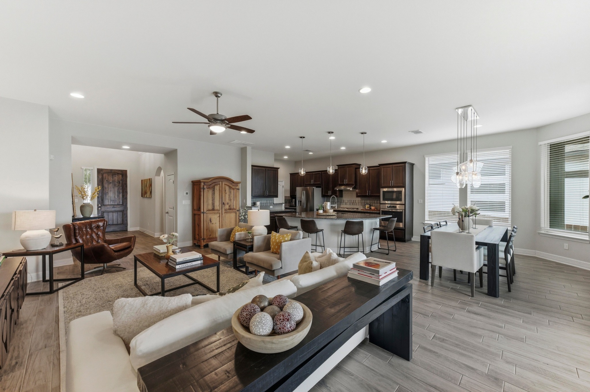 348 Panzano Drive Georgetown, TX 78628 - Photo 10 of 35 a living room with furniture kitchen view and a chandelier