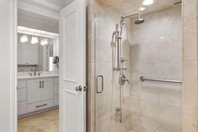 a bathroom with a shower and a sink