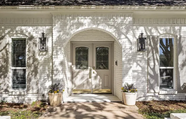 a front view of a house with lake view