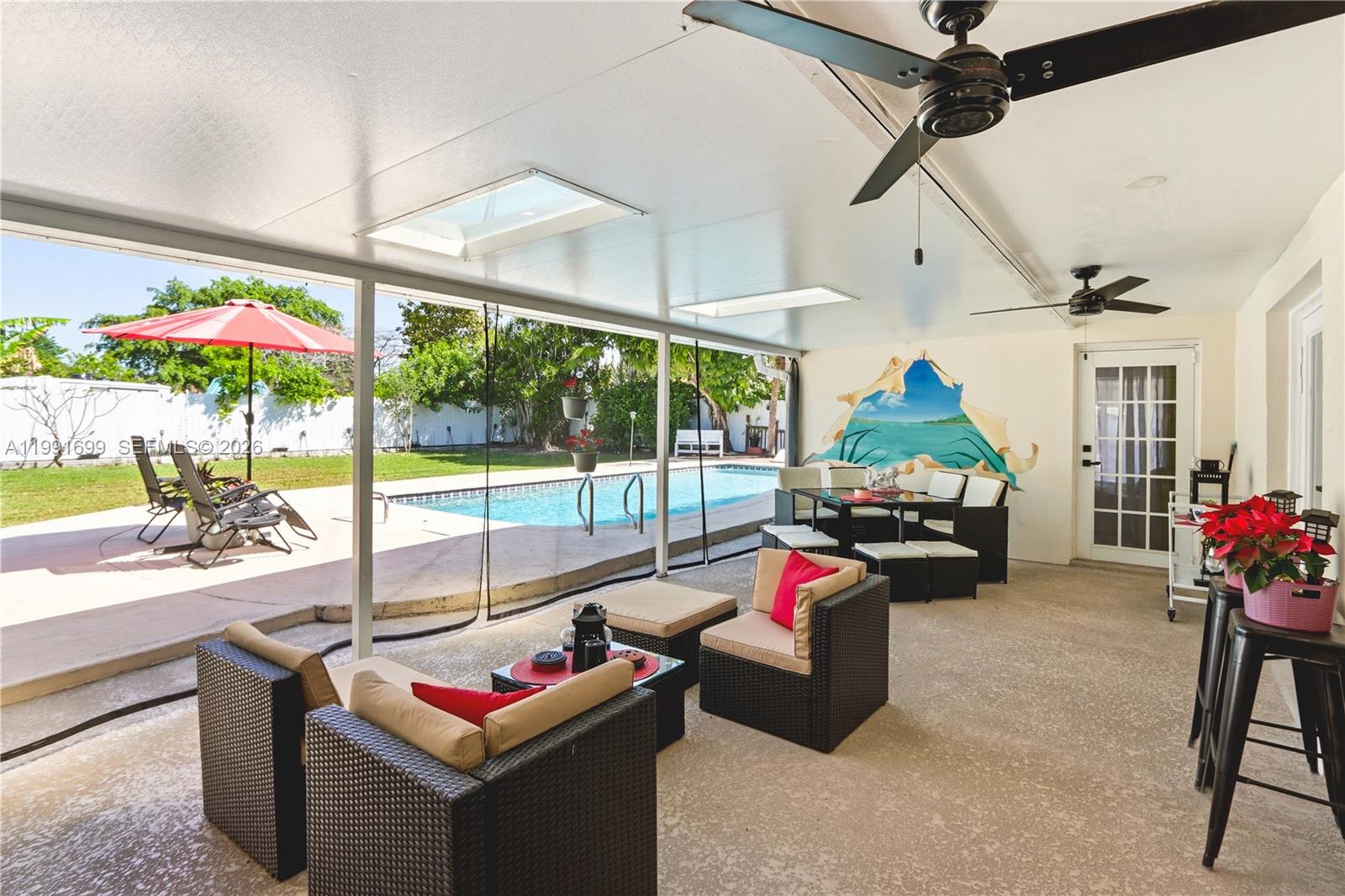 9955 Southwest 74th Street Miami, FL 33173 - Photo 23 of 28 a living room with furniture and a floor to ceiling window