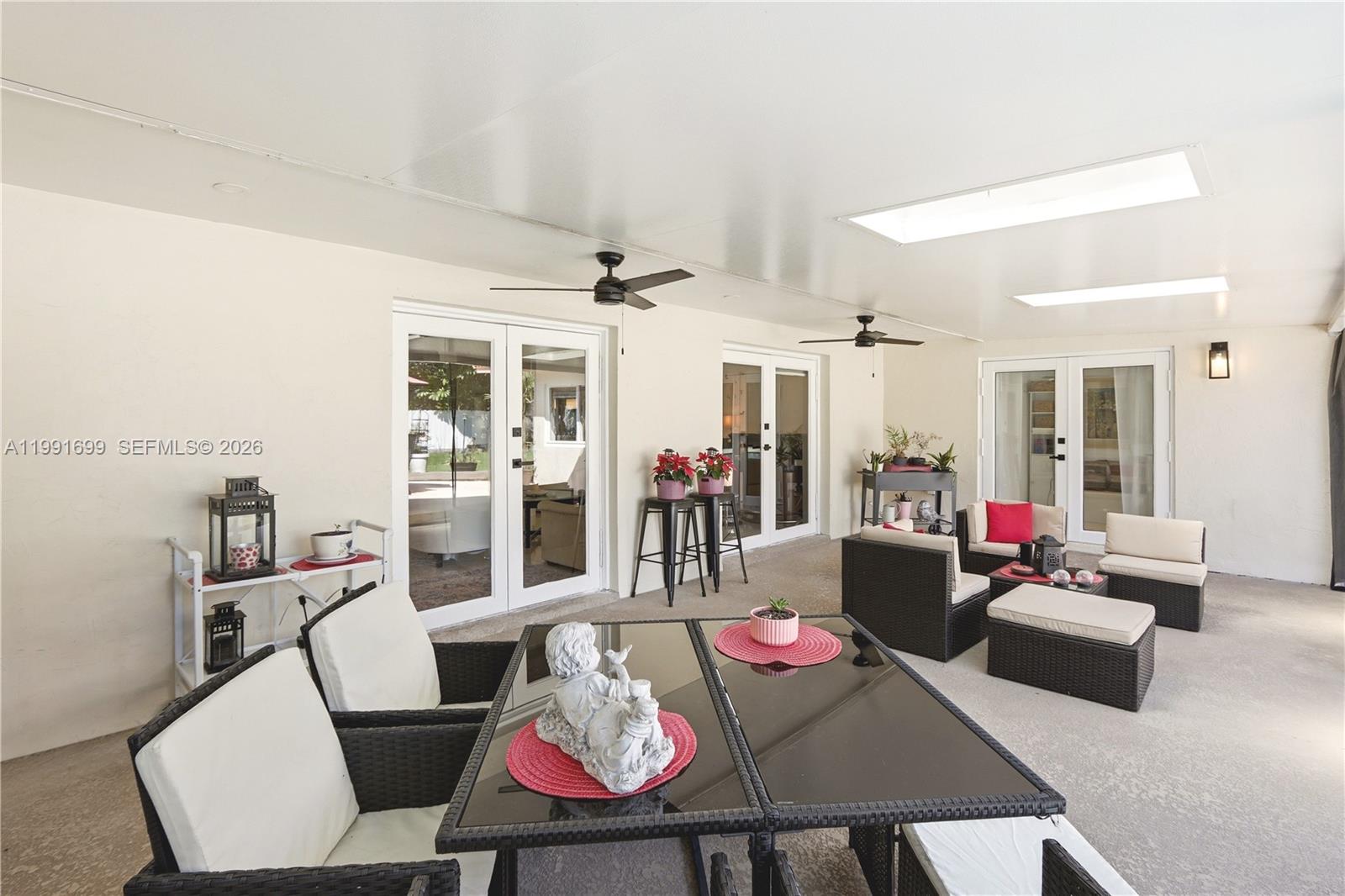 9955 Southwest 74th Street Miami, FL 33173 - Photo 24 of 28 a living room with furniture and a wooden floor