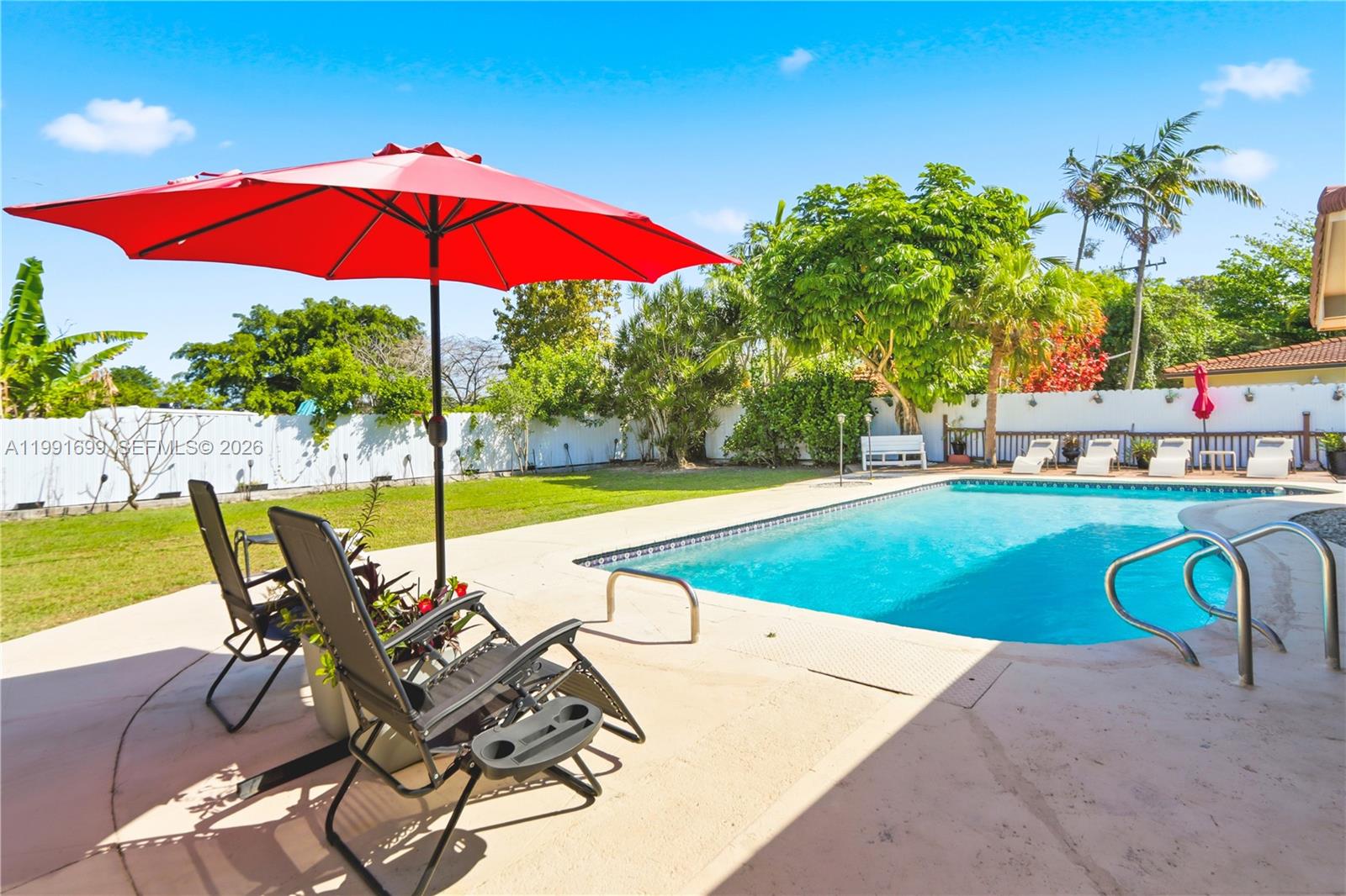 9955 Southwest 74th Street Miami, FL 33173 - Photo 25 of 28 a view of a swimming pool with sitting area