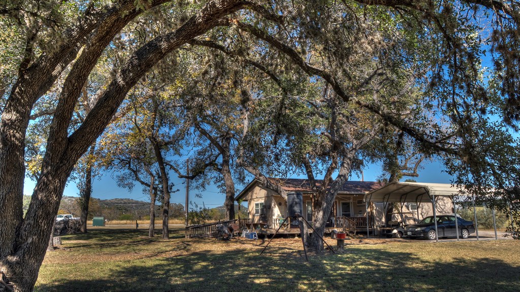 218 Trickling Creek Road Rio Frio, TX 78879 - Photo 13 of 39 a street view with large trees