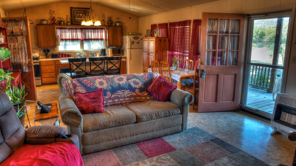 218 Trickling Creek Road Rio Frio, TX 78879 - Photo 21 of 39 a living room with furniture and a flat screen tv