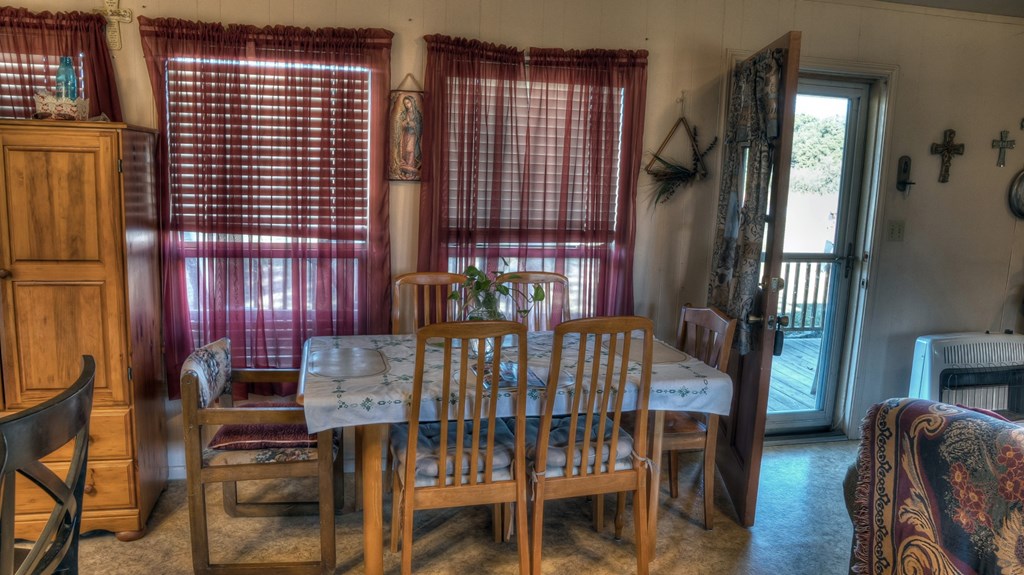 218 Trickling Creek Road Rio Frio, TX 78879 - Photo 27 of 39 a view of a dining room with furniture and chandelier