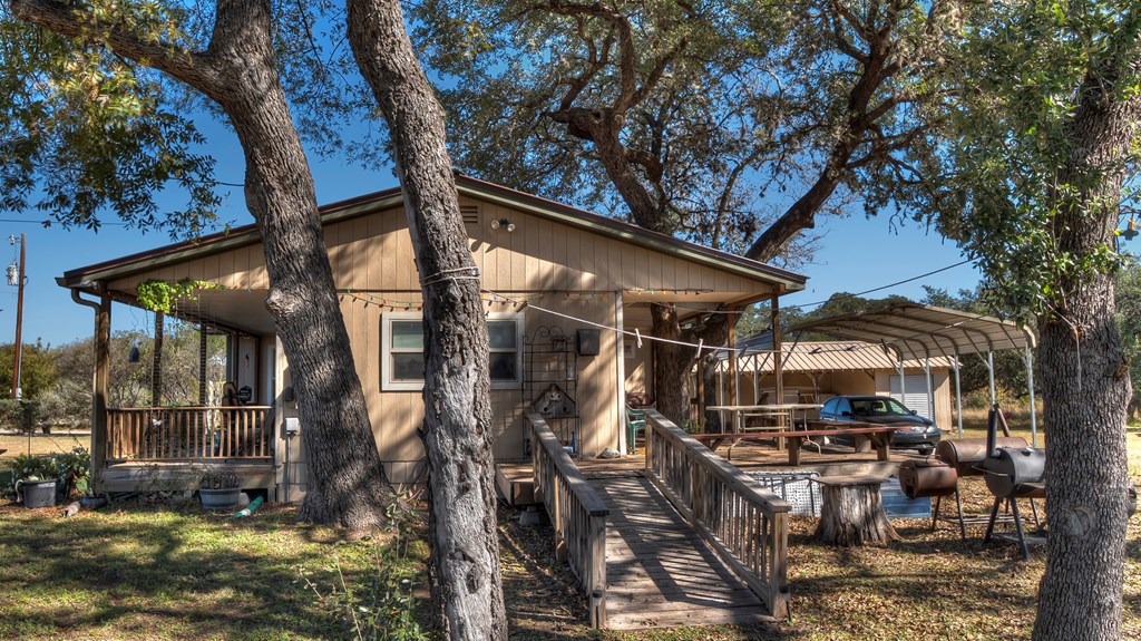 218 Trickling Creek Road Rio Frio, TX 78879 - Photo 5 of 39 a view of a house with a yard