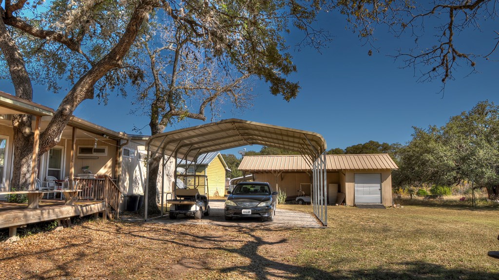 218 Trickling Creek Road Rio Frio, TX 78879 - Photo 8 of 39 a view of a house with a patio